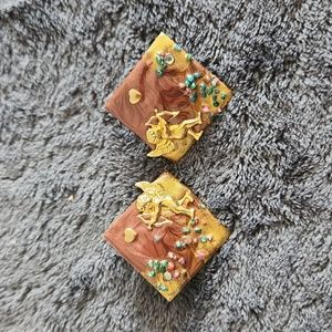 Metal cupid earrings